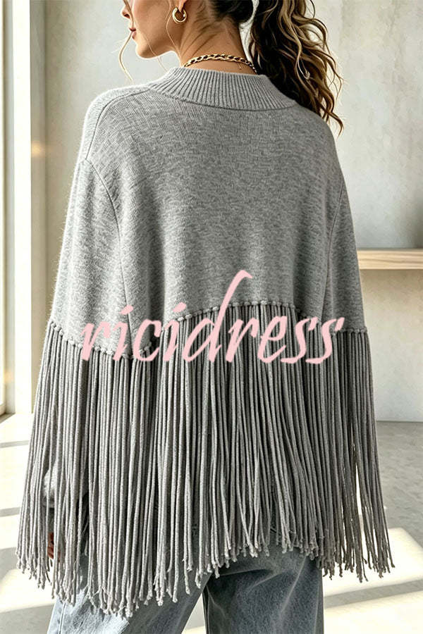 Women's knit cape sweater with crew neck and long tassel hem