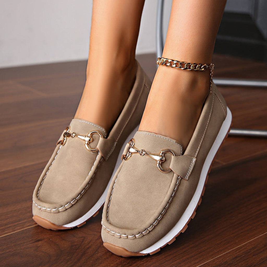 Women's flat loafers with moc toe stitching and metal buckle detail