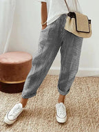 Women's cropped striped trousers with elastic waist and cuffed hems