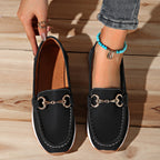 Women's flat loafers with moc toe stitching and metal buckle detail