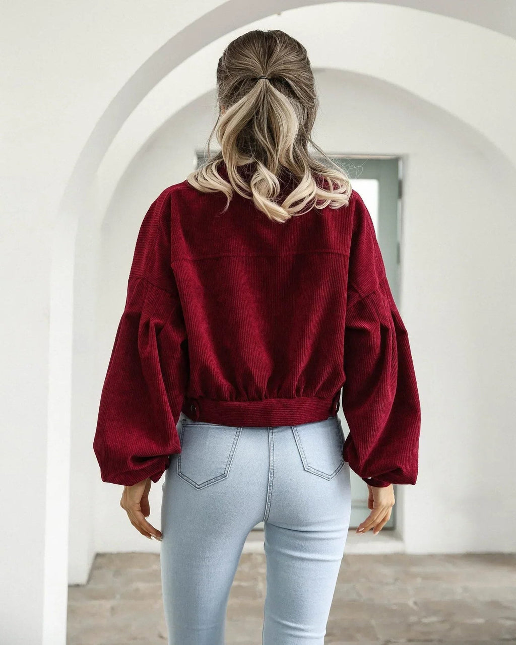 Women's cropped corduroy bomber jacket with button front and chest pockets