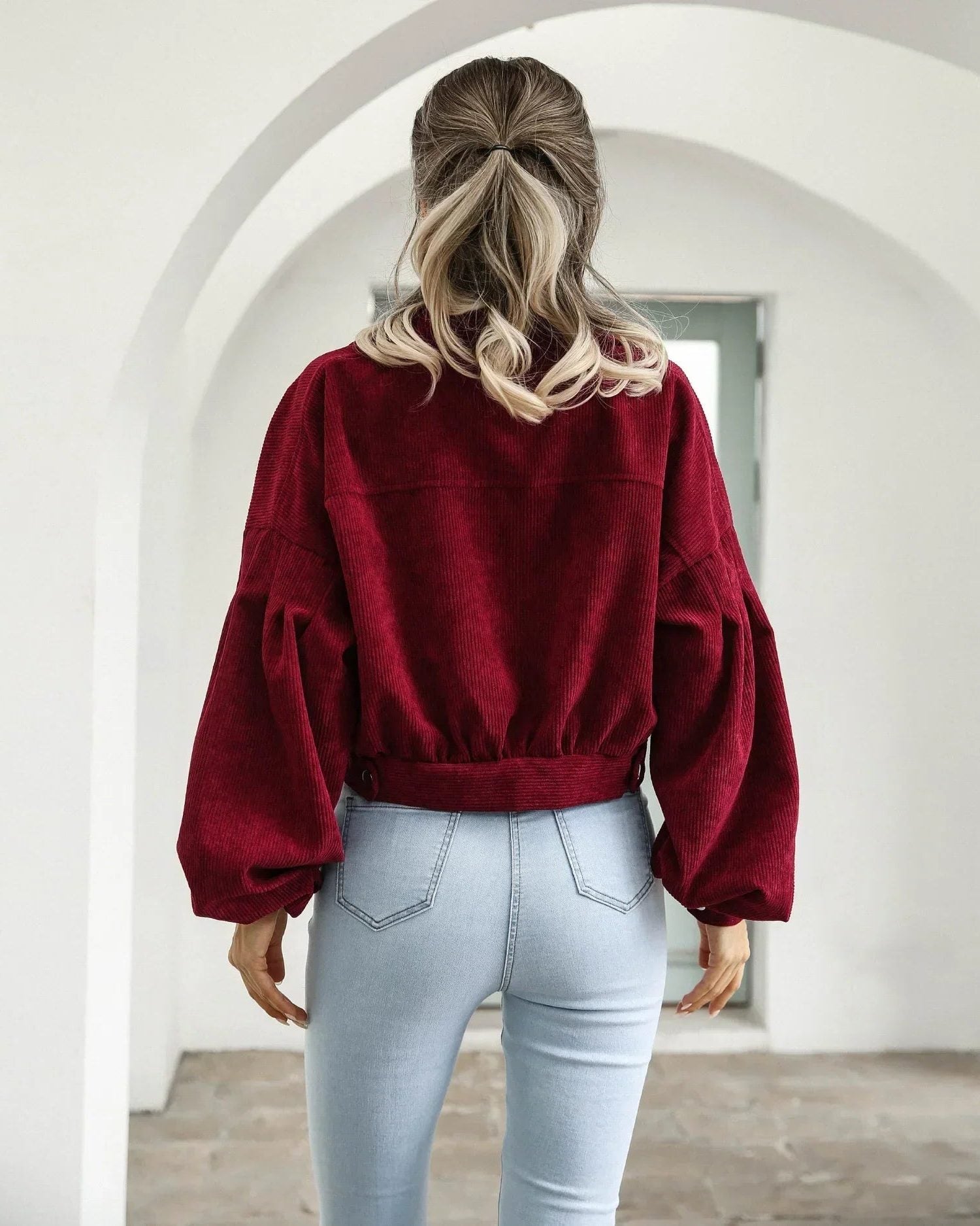 Women's cropped corduroy bomber jacket with button front and chest pockets