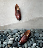 Men's brown polished penny loafer with almond toe and low heel