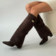 Women's over-the-knee boots with pointed toes, low heels, side zips and buckle strap details