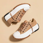 Women's platform sneakers with lace-up fronts, rounded toes and serrated soles