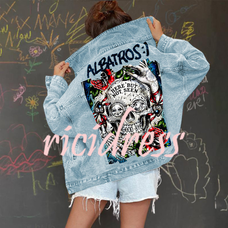 Women's light blue denim jacket with Halloween skull and rose graphic on the back
