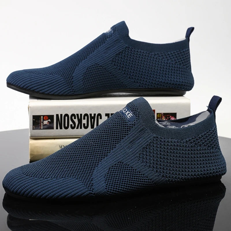 Knit barefoot-style slip-on shoes with textured panels and pull tabs