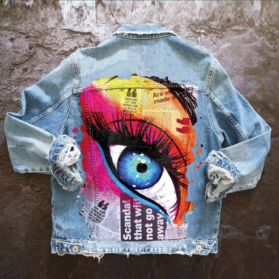 Women's denim jacket with colourful graphic eye print on the back