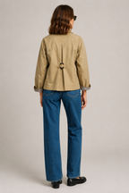 Women's beige short trench jacket with button front and checked turn-back cuffs