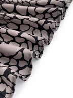Women's grey and black snakeskin print blouse with lapel collar and long sleeves