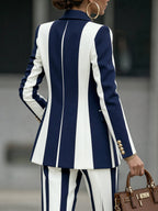 Women's navy and white striped blazer with notched lapels and long sleeves