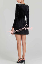 Women's velvet mini dress with embellished square neckline, long sleeves and flared skirt