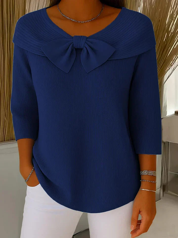 Women's ribbed sweater with a large bow and three-quarter sleeves