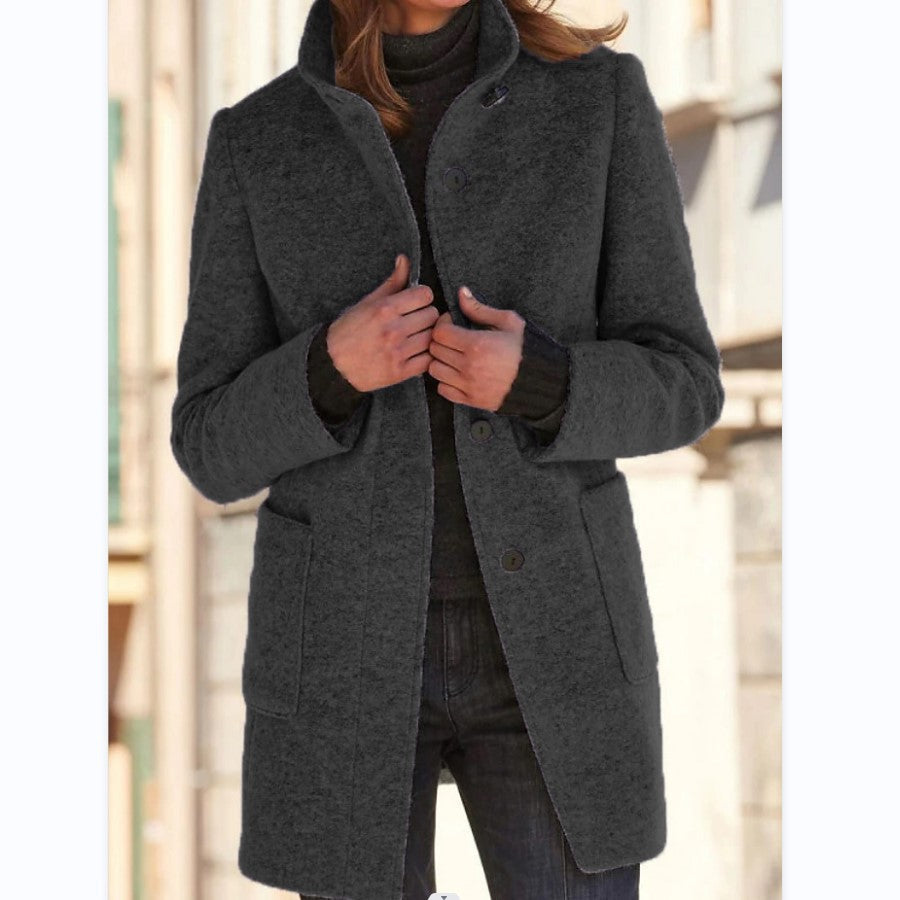 Women's button front coat with raised collar, long sleeves and front pockets