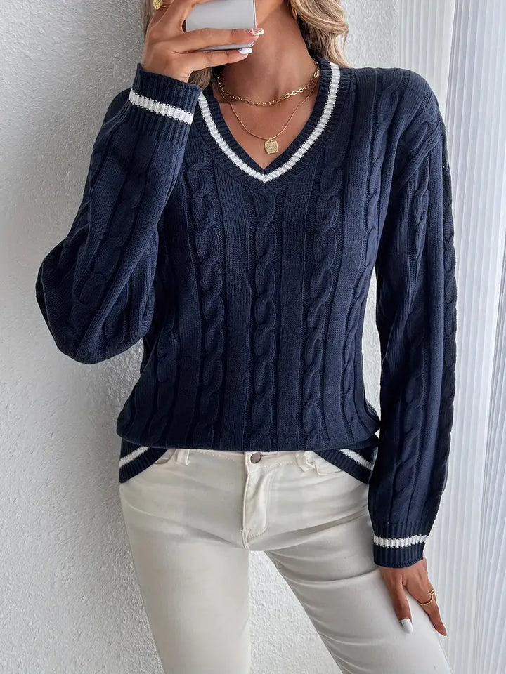 Women's navy cable knit V-neck sweater with contrast striped trims