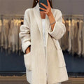 Women's textured open front longline cardigan with long sleeves and patch pockets