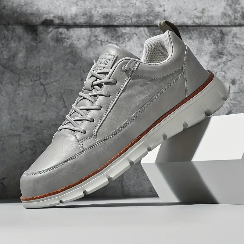 Low top lace-up sneaker with stitched panels and chunky textured sole