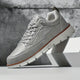 Low top lace-up sneaker with stitched panels and chunky textured sole