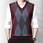 Men's sleeveless argyle V-neck sweater vest layered over a white shirt