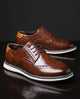 Wingtip brogue trainers with perforated panels and layered soles