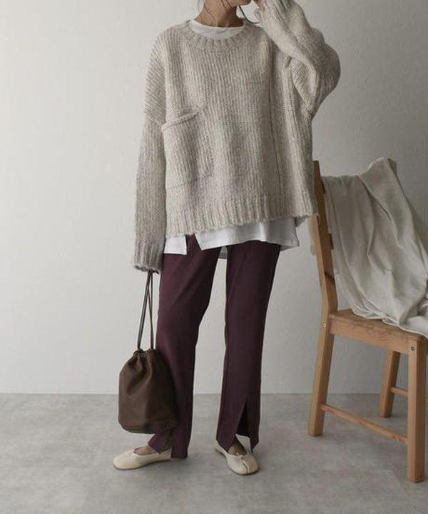 Women's ivory chunky knit sweater with crew neckline and front pockets