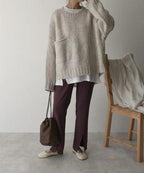 Women's ivory chunky knit sweater with crew neckline and front pockets