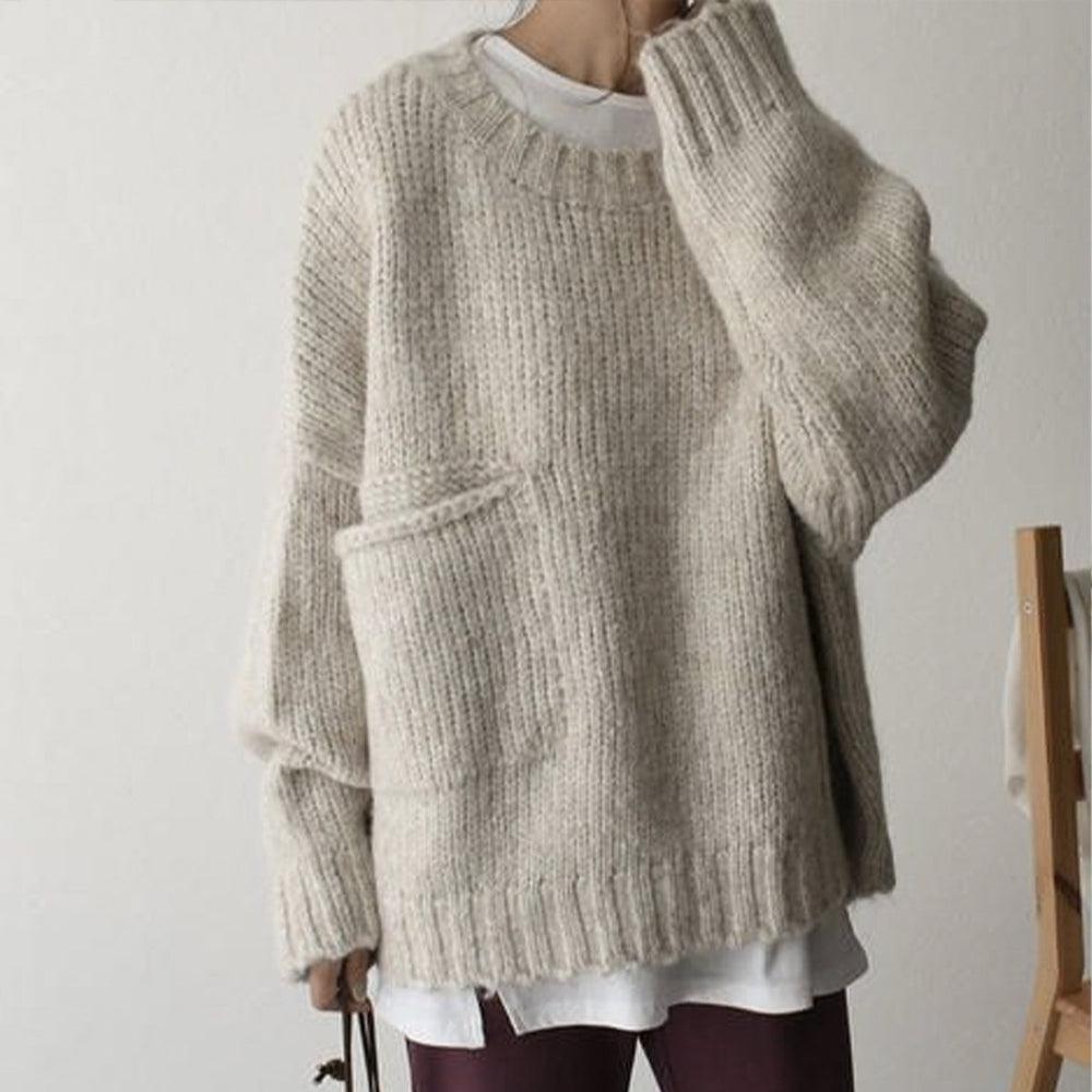 Women's ivory chunky knit sweater with crew neckline and front pockets