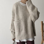 Women's ivory chunky knit sweater with crew neckline and front pockets