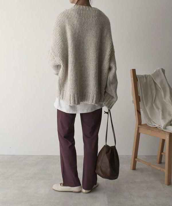Women's ivory chunky knit sweater with crew neckline and front pockets
