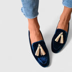 Women's deep blue almond-toe loafers with gold-tone tassel trim