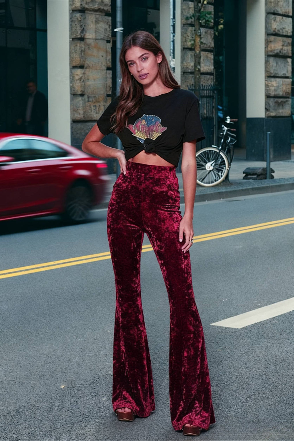 Woman wearing high-waisted wide-leg flared velour trousers
