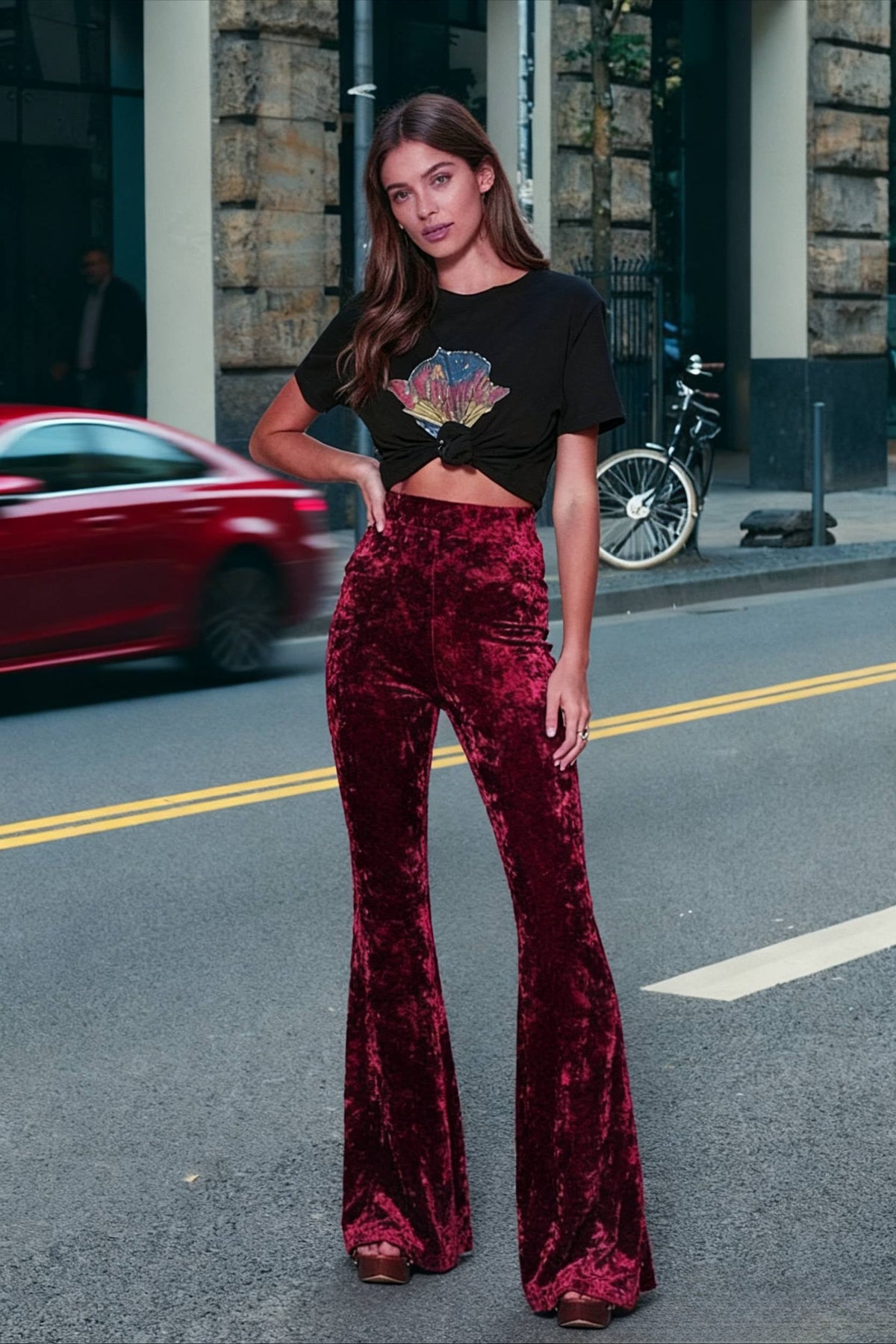 Woman wearing high-waisted wide-leg flared velour trousers