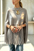 Women's knit cape sweater with crew neck and long tassel hem