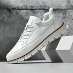 Low top lace-up sneaker with stitched panels and chunky textured sole