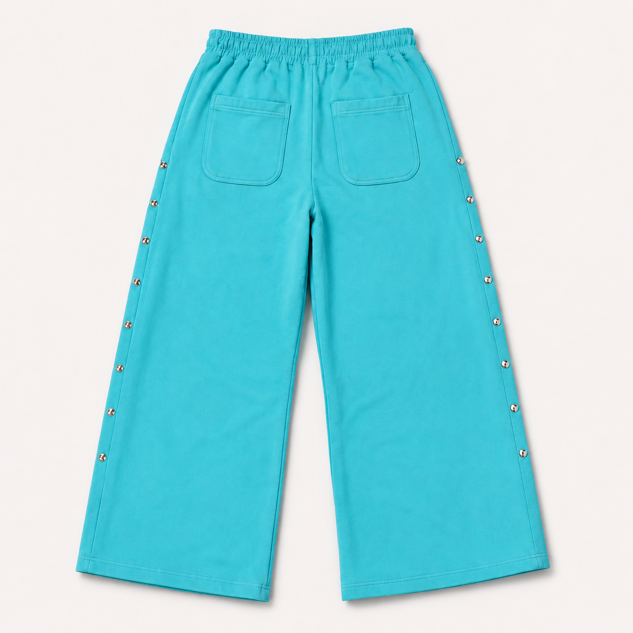 Women's turquoise wide leg jogger trousers with side snaps and drawstring waist