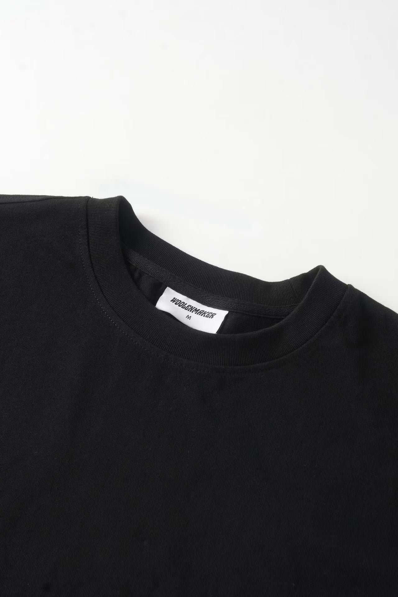 Men's black crew neck sweatshirt with white graphic sleeves