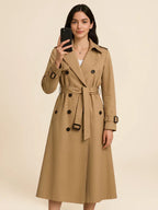 Women's belted double-breasted trench coat with long sleeves and lapel collar