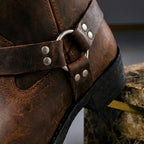 Tall men's biker boot with ankle straps, metal studs and low heel