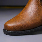 Men's ankle boots with buckled straps, stud details and low heels