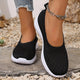 Women's knitted slip-on shoes with closed rounded toe and white ridged sole