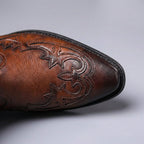 Western ankle boots with pointed toes and stitched panels