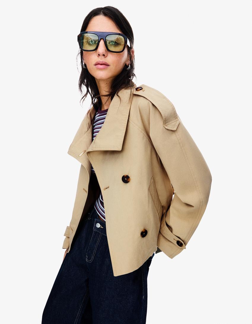 Women's belted trench jacket with high collar, long sleeves and front buttons