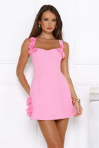 Pink mini dress with square neckline and floral appliques
