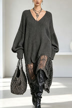 Women's ribbed knit V-neck dress with long sleeves and asymmetrical openwork hem