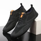 Knit sneakers with lace-up fronts, round toes and pull tabs