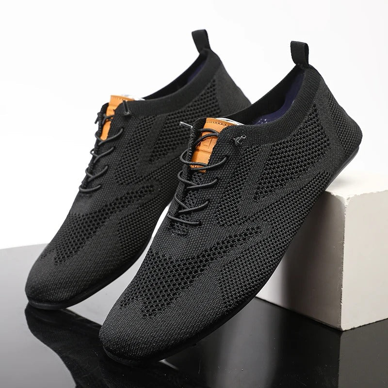 Knit sneakers with lace-up fronts, round toes and pull tabs