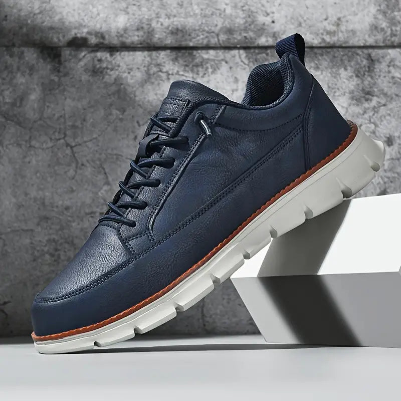 Low top lace-up sneaker with stitched panels and chunky textured sole