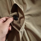 Men's collared waterproof trench coat with button fastening