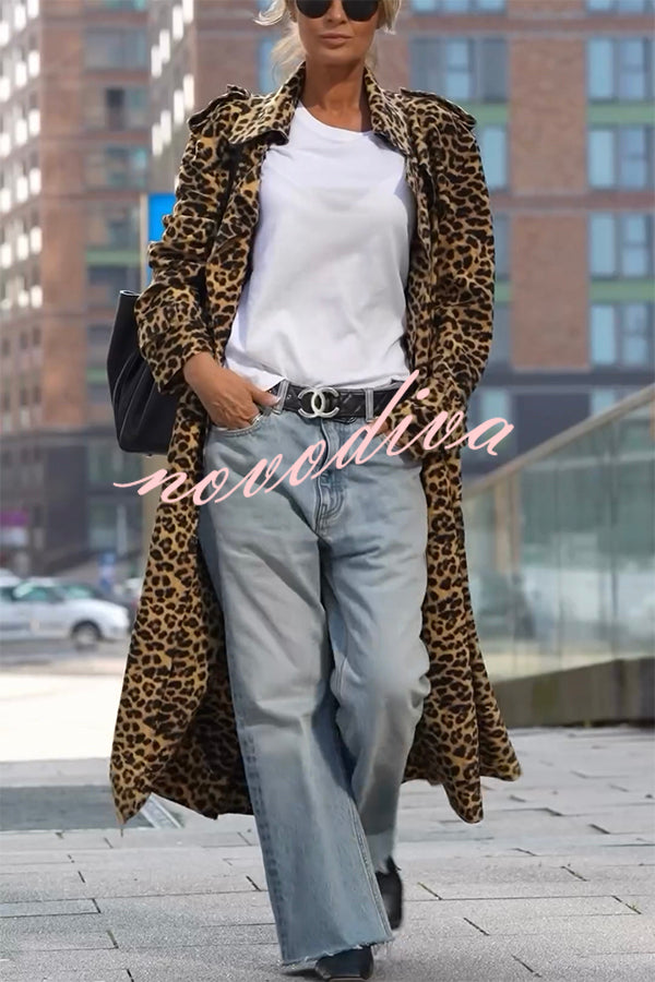 Woman wearing a leopard print long sleeve midi trench coat