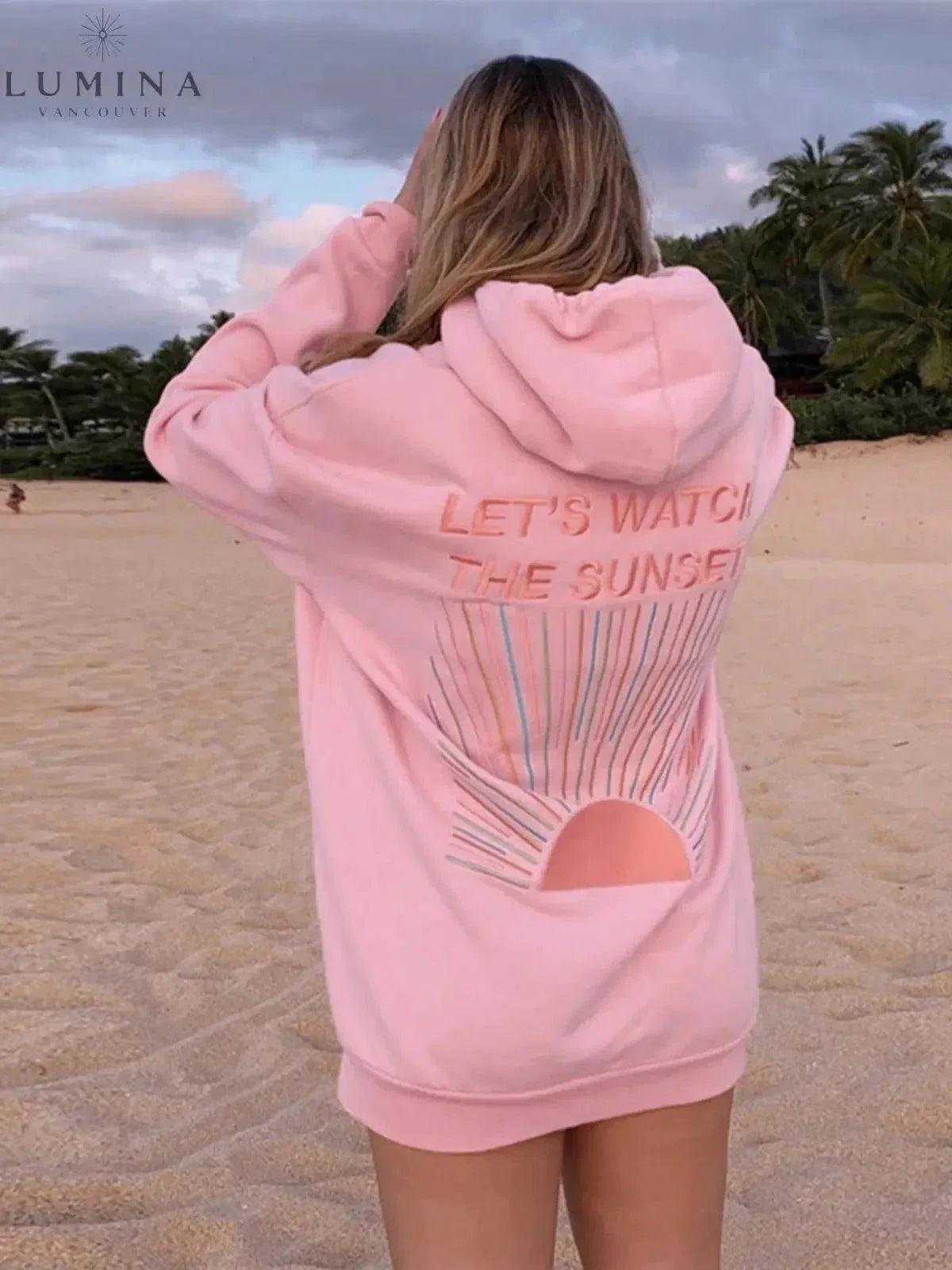 Women's hoodie with sunset graphic on the back